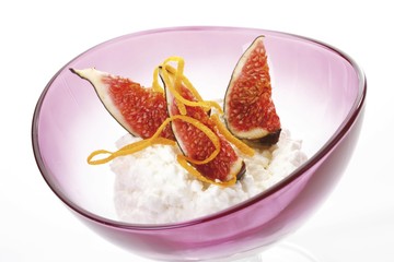 Fresh figs on cottage cheese decorated with orange peals