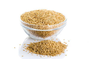sesame placed in a bowl on a white background