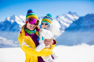 Fototapeta na wymiar Family ski and snow fun in winter mountains