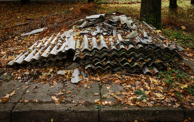 Old and dangerous asbestos roof. Asbestos fibers in the environment.