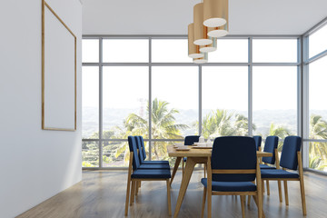 Dining room with a poster, palms, side