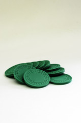 Obraz na płótnie Canvas Vertical view of a Pile of green poker chips