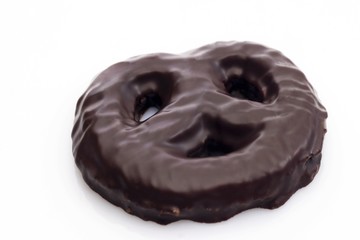 Pretzel-shaped chocolate-glazed gingerbread cookie