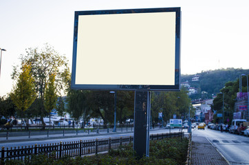 horizontal blank billboard on the city street in background buildings and road with cars mock up