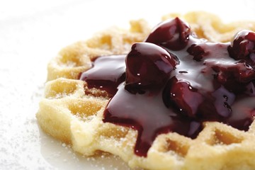 Waffle topped with sour cherries