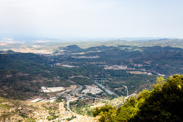 The view over the valley, part of which is illuminated by the sun