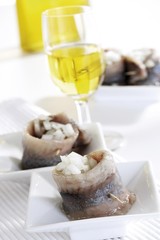 Fresh matie rolls with onion cubes and Slivovitz