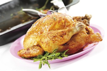 Whole grilled chicken on a plate