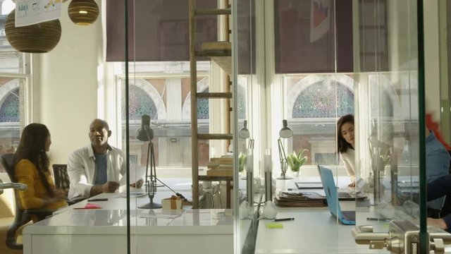  Time lapse casual business team working & brainstorming in creative office