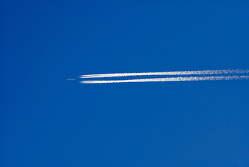 Airliner with vapour trails