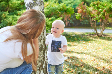 Happy beautiful mother and baby daughter or son