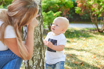 Happy beautiful mother and baby daughter or son