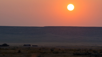 Sunrise on the prairie, through the smoke from forest fires