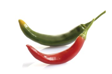 Two peperonis, green and red