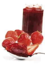 Fresh strawberries and glass of strawberry jam