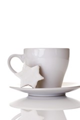 Coffee cup and cinnamon star cookie