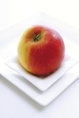Red apple on a plate