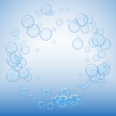 Fototapeta na wymiar Light soap bubbles on blue background round frame