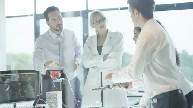  Scientific research engineers working in lab with computer & 3D printer