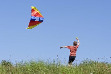 Young boy flying a kite