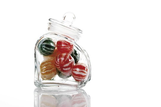 Striped sweets in a glass jar