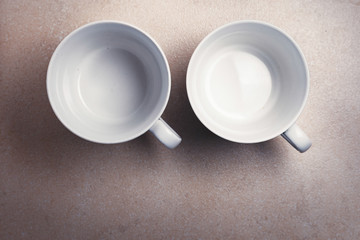 Two empty coffee cups from top view