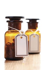 Brown apothecary bottles with tie-on labels