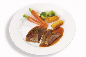 Roast goose-breast with gravy, potato croquettes, sprouts and carrots
