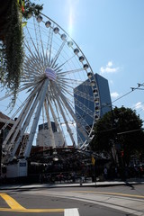 Low Angle View of City Carousel Against Buildings