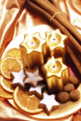 Golden candles in a Christmas display