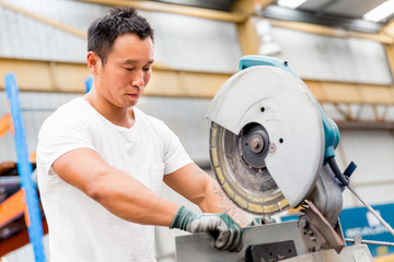 Asian worker in production plant on the factory floor