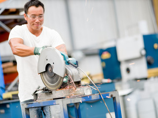 Asian worker in production plant on the factory floor