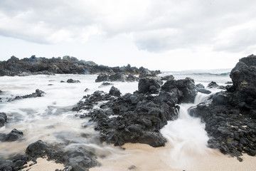 Powerful ocean current rushing in to beach