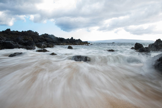 Powerful Ocean Current Rushing In To Beach