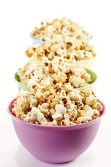 Popcorn in coloured plastic bowls