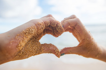 Fototapeta premium Hands forming the shape of a heart