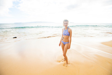 Fototapeta na wymiar Teenage girl alone at tropical island ocean