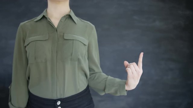  Unrecognizable woman pointing & swiping on blank chalkboard background