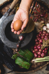 Lanna food Hand show lemon Eggs and onion  Thai food Northern Thai Cuisine Rustic kitchen Old hand Hands are cooking 