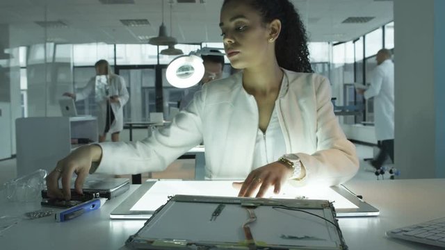  Timelapse research engineers working in lab building electronics & robotics. 