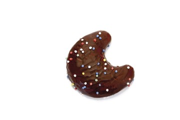 Chocolate coated gingerbread crescent moon biscuit with sugar pearls