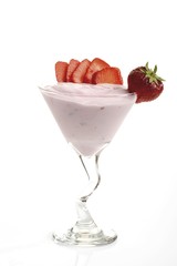 Glass of yogurt garnished with strawberries