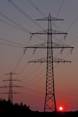 Sunset behind a power pylon, Lueneburg, Lower Saxony, Germany, Europe