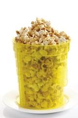 Popcorn in a yellow plastic bucket