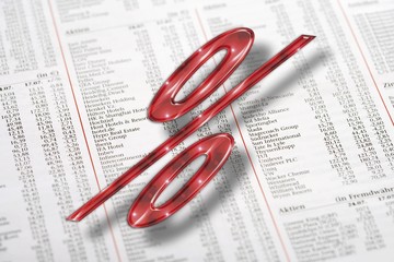 Red percent symbol and financial newspaper