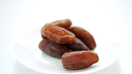 Dried Dates Fruits on dish white background