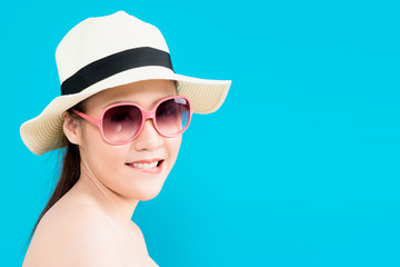 Young Asian woman flirting isolated on blue background.