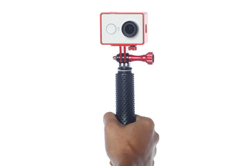 take a selfie using action camera isolated with white background with monopod stick.
