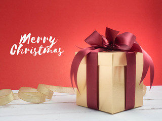 Valentine festival , New year Gold gift box with red ribbon. Red background for create idea copy...