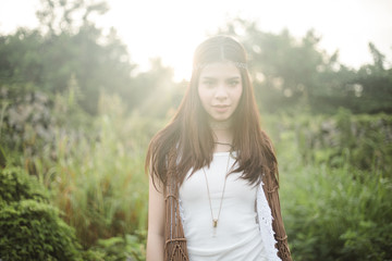 Young asian lady in the garden